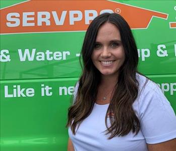 SERVPRO office manager is shown, female, long brown hair