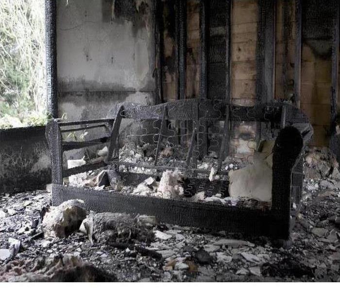 A room and furniture destroyed by a fire are shown
